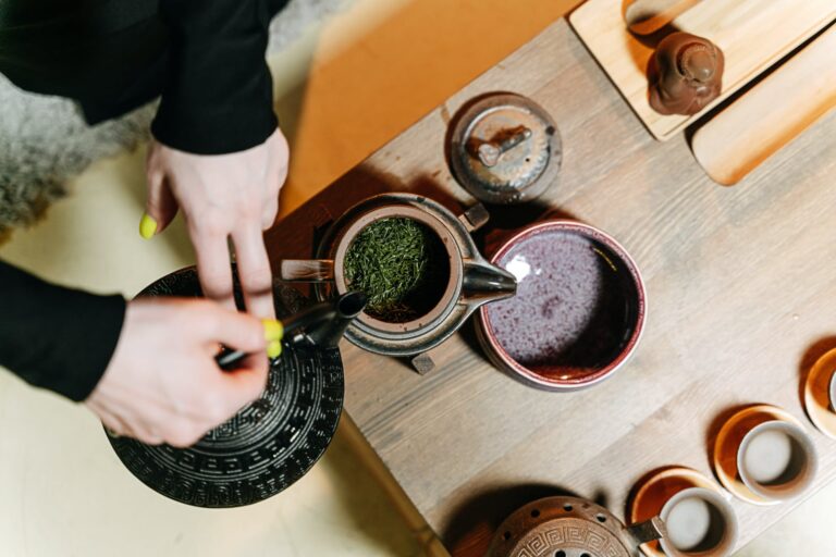 person holding a teapot